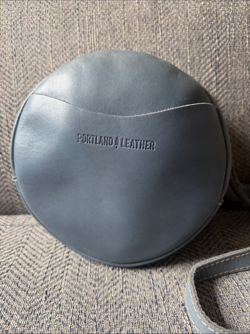 Portland Leather Goods Small Circle Crossbody Bag for Women in Blue.